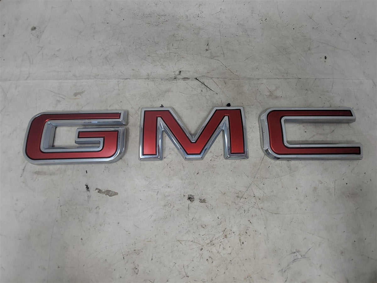 Used OEM 2019-2026 SIERRA 1500 GMC TAILGATE EMBLEM RED, actual item photo 1