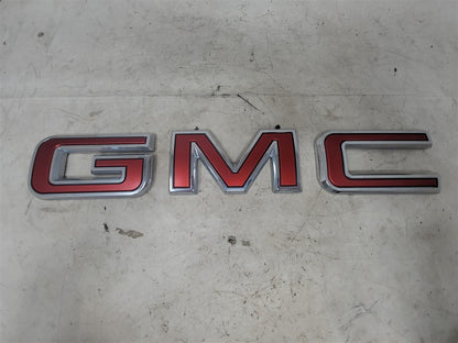 Used OEM 2019-2026 SIERRA 1500 GMC TAILGATE EMBLEM RED, actual item photo 1